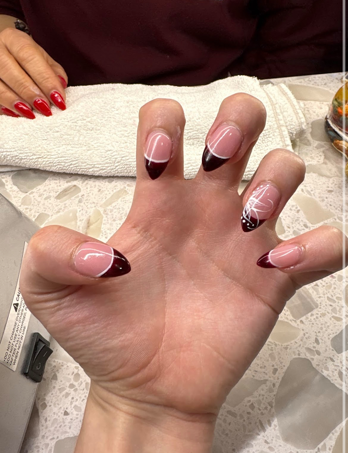 Wine french tip stiletto nails with line art