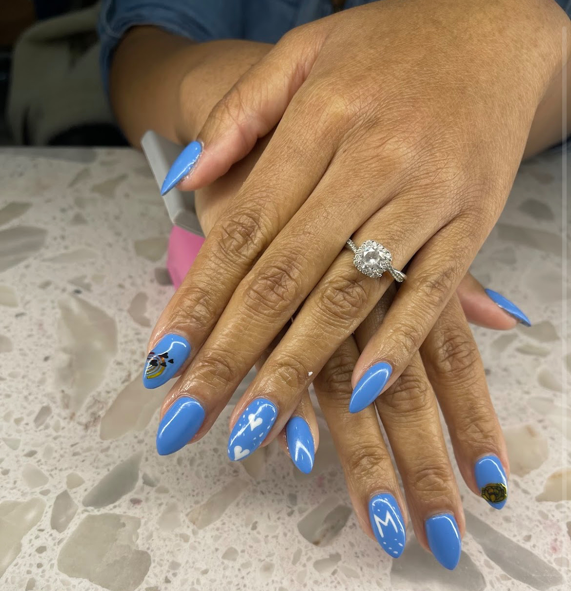 Blue almond nail art with custom accents