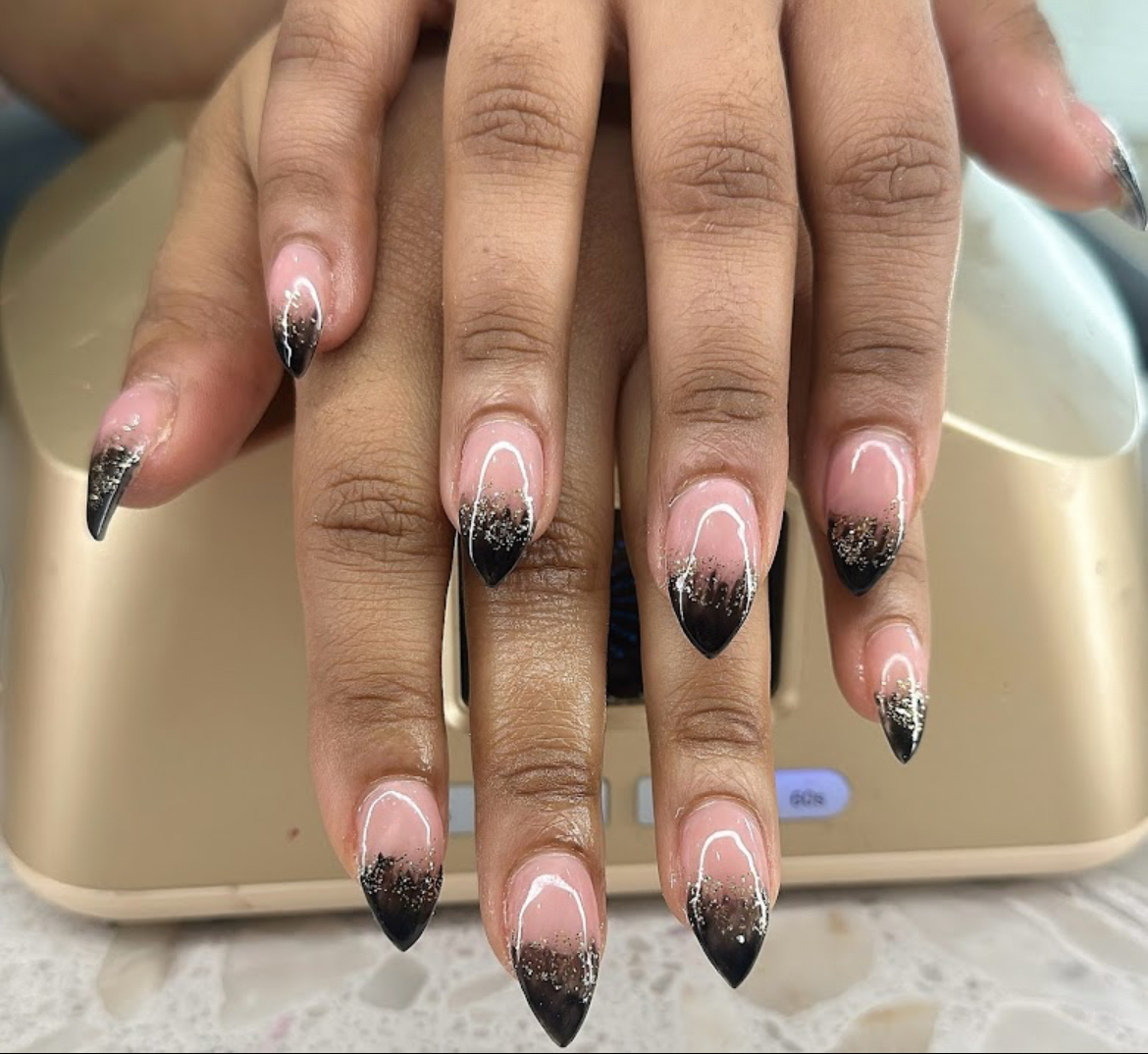 Black ombre stiletto nails with glitter