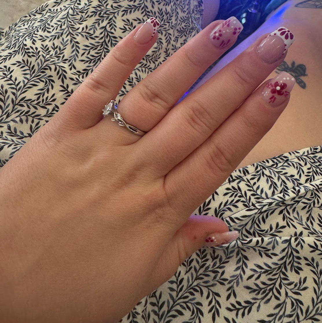 Burgundy floral manicure full hand view